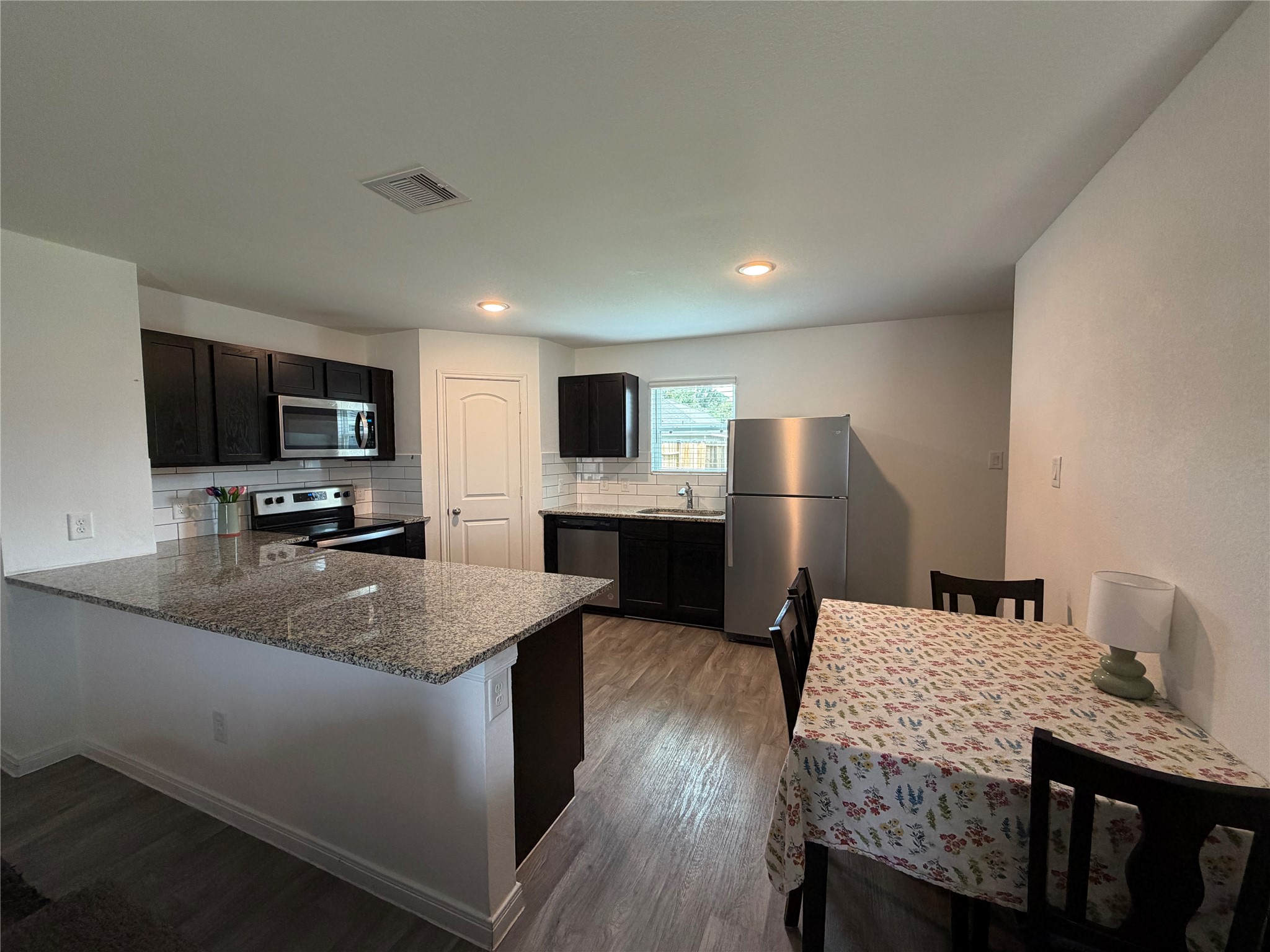 16550 Colleen Place Conroe, TX 77306 - Photo 3 of 19 Kitchen/Dining Room