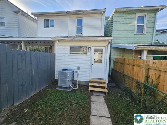 a view of backyard with seating space