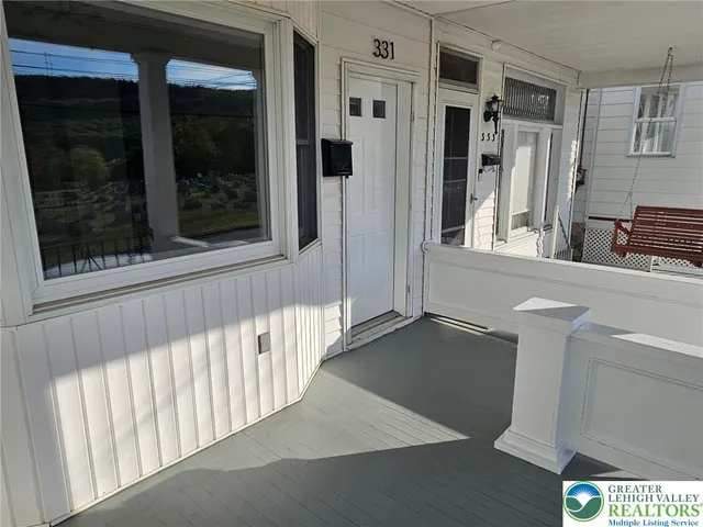a view of a hallway with a window