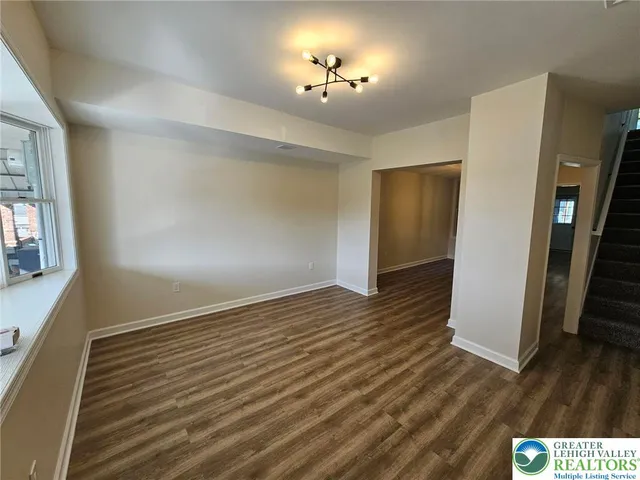 a view of livingroom with hardwood floor and a ceiling fan