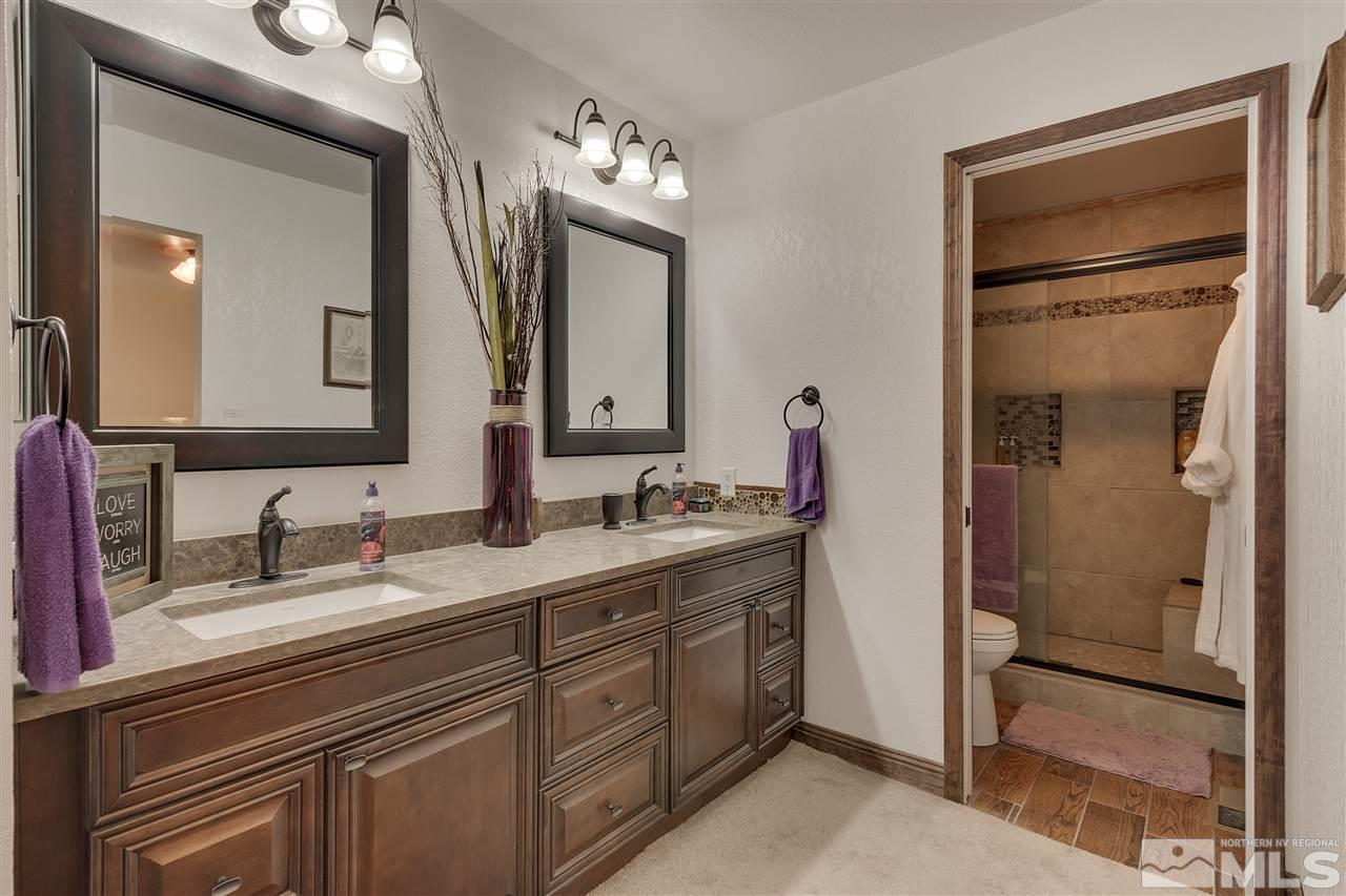 1661 Foster Drive Reno, NV 89509 - Photo 11 of 17 a bathroom with a double vanity sink and a mirror