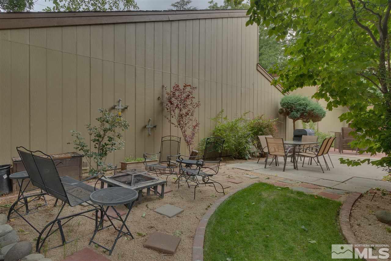1661 Foster Drive Reno, NV 89509 - Photo 7 of 17 a view of a backyard with table and chairs