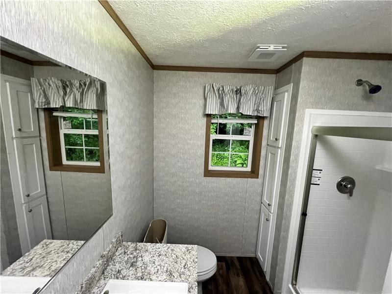 206 Iron Furnace Road East Brady, PA 16028 - Photo 12 of 15 a bedroom with a bed and a window