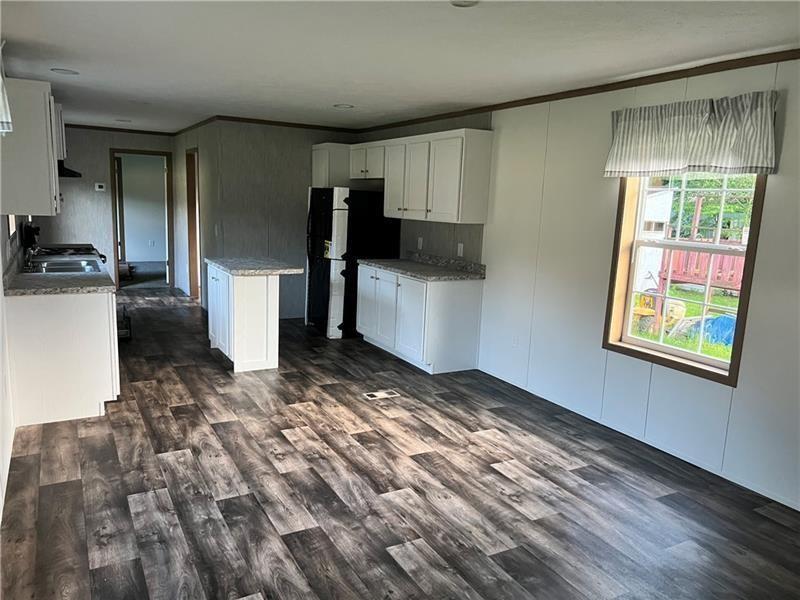 206 Iron Furnace Road East Brady, PA 16028 - Photo 5 of 15 a view of a refrigerator in kitchen and a window