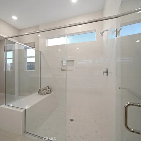 a bathroom with a shower and a sink
