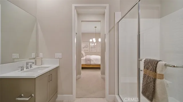 a en suite bathroom with a sink and mirror