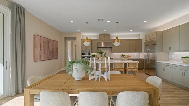 a dining room with furniture and wooden floor