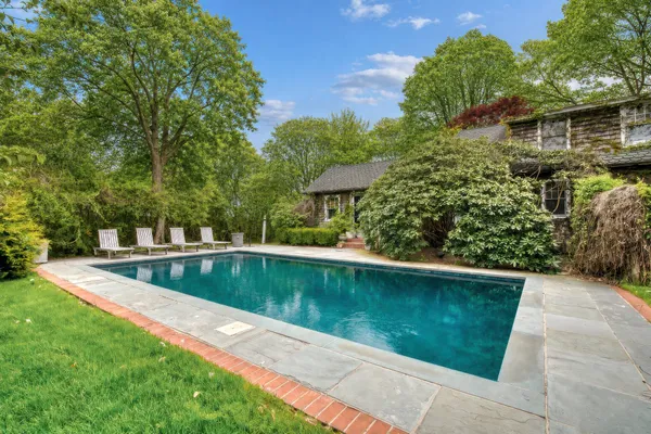 a view of a swimming pool with a patio