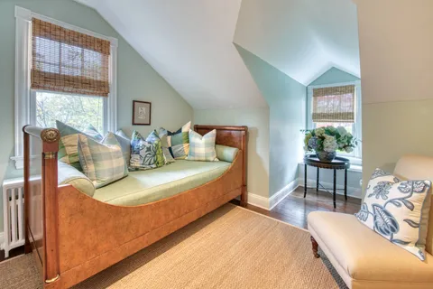 a bedroom with bed and window