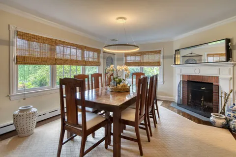 a dining room with furniture window and outside view