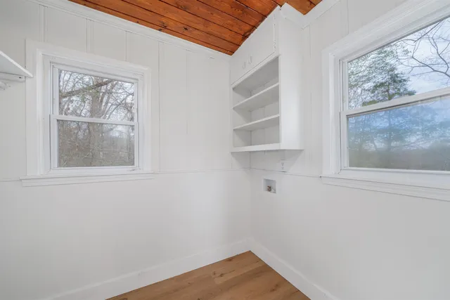 a view of empty room with windows