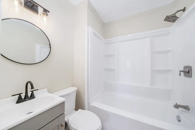 a bathroom with a sink a toilet and a bathtub