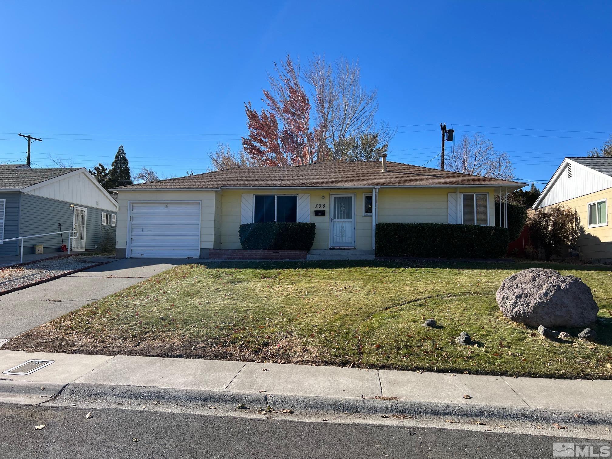 735 Reeves Avenue Reno, NV 89503 - Photo 1 of 15 a front view of a house with a yard