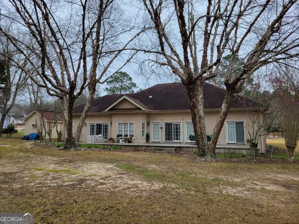 a view of a dining room with furniture and window