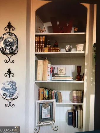 a kitchen with refrigerator and cabinets
