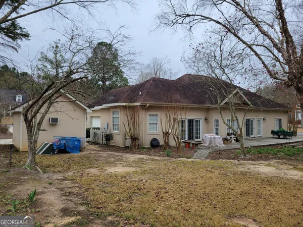 a bedroom with a bed and lamp with the view of bedroom