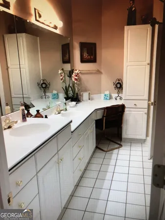 a kitchen with stainless steel appliances kitchen island granite countertop a sink and cabinets