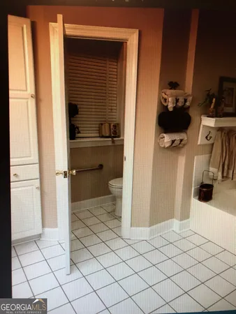 a kitchen with stainless steel appliances a refrigerator and a stove top oven