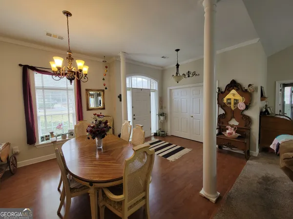a view of a dining room with furniture