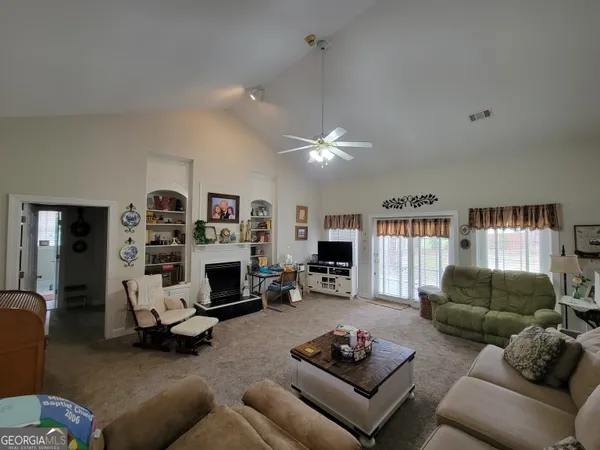 a bedroom with furniture and a chandelier