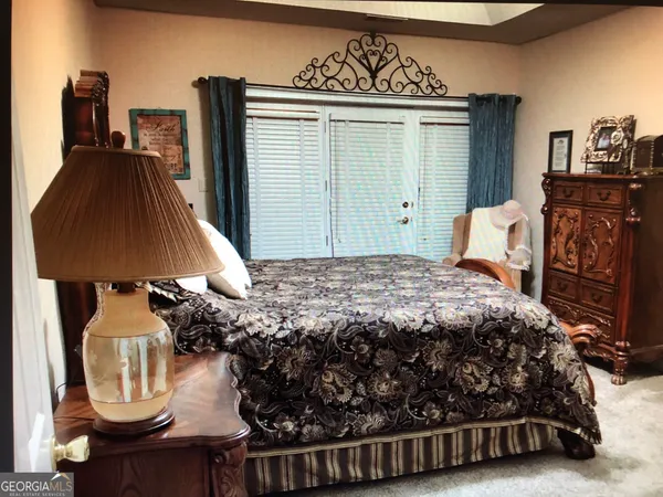 a bedroom with a bed and a closet