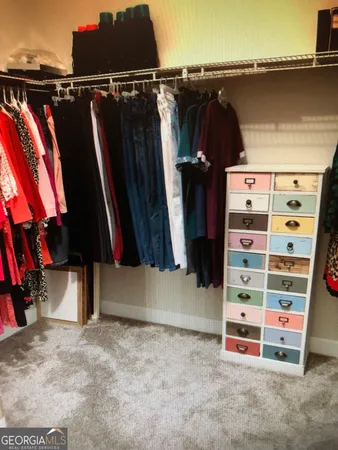 a spacious bathroom with a double vanity sink and a mirror