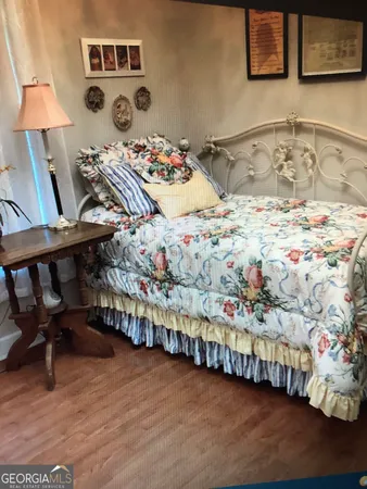 a white toilet sitting next to a sink