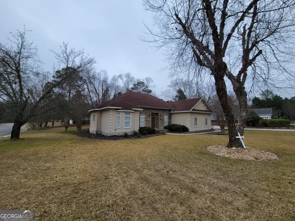 a front view of a house with a yard