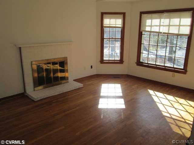 5805 Mill Spring Road Midlothian, VA 23112 - Photo 3 of 8 an empty room with wooden floor and windows