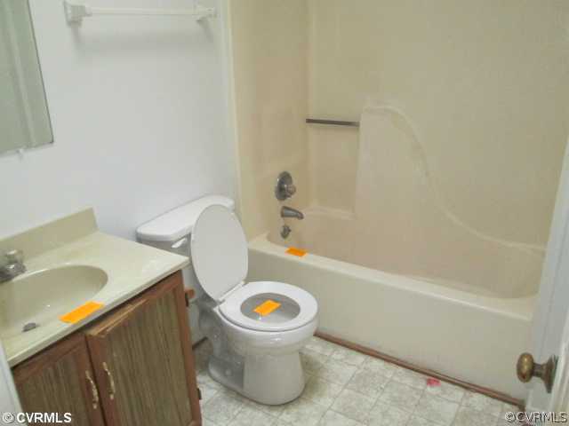 5805 Mill Spring Road Midlothian, VA 23112 - Photo 5 of 8 a bathroom with a sink a toilet and a bathtub