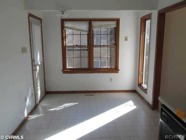 5805 Mill Spring Road Midlothian, VA 23112 - Photo 6 of 8 an empty room with windows
