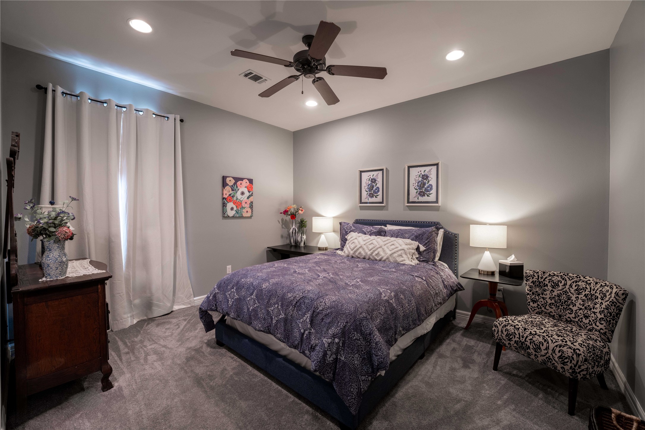 1820 Guenther Road La Grange, TX 78945 - Photo 14 of 29 a bedroom with a bed and a chandelier