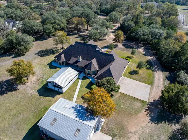 an aerial view of a house with a garden
