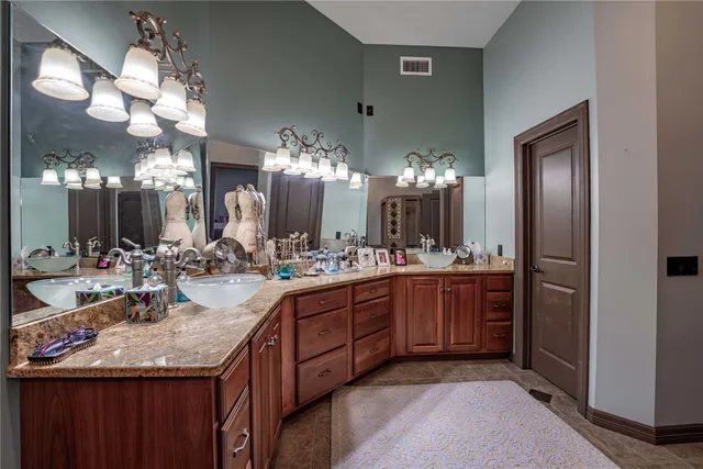 a kitchen with sink and refrigerator