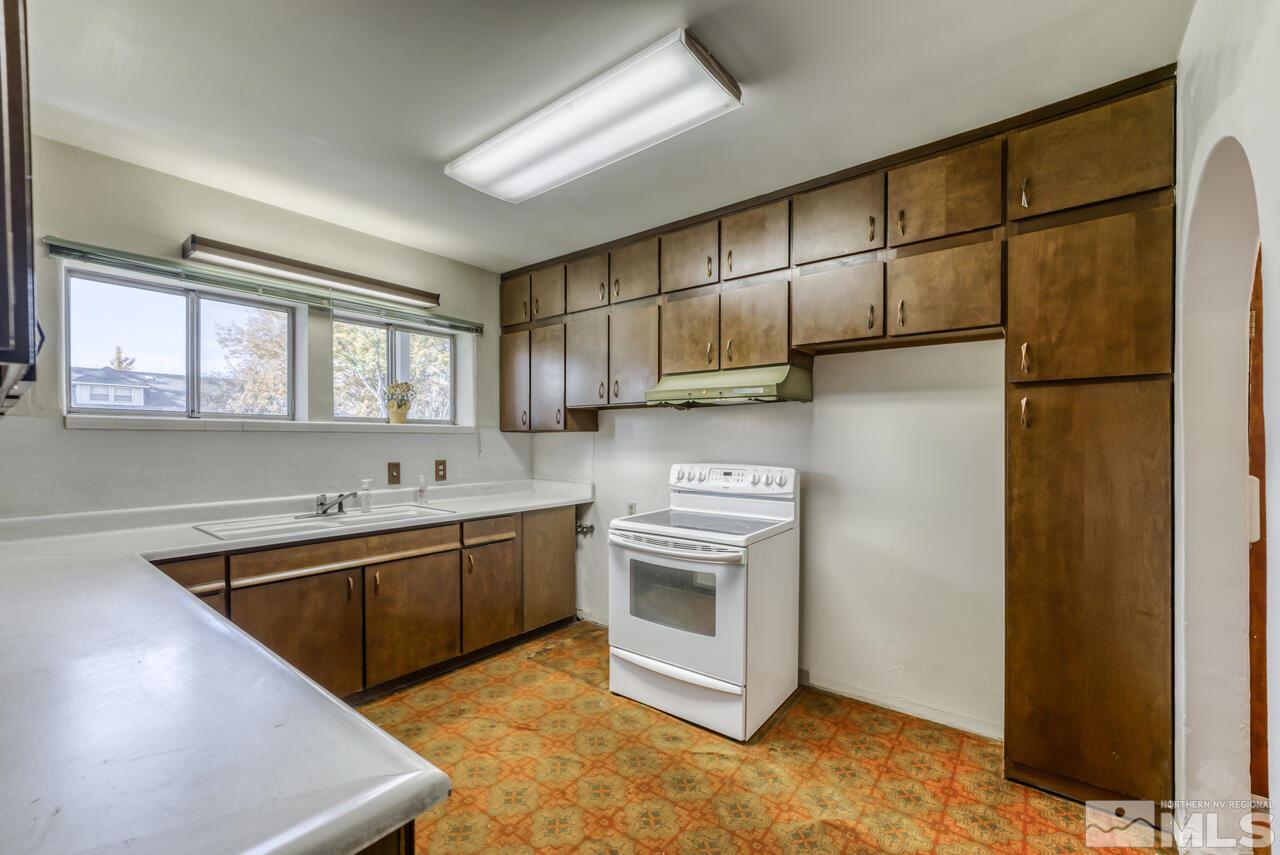 160 Circle Drive Reno, NV 89509 - Photo 13 of 25 a kitchen with stainless steel appliances granite countertop a sink stove and refrigerator