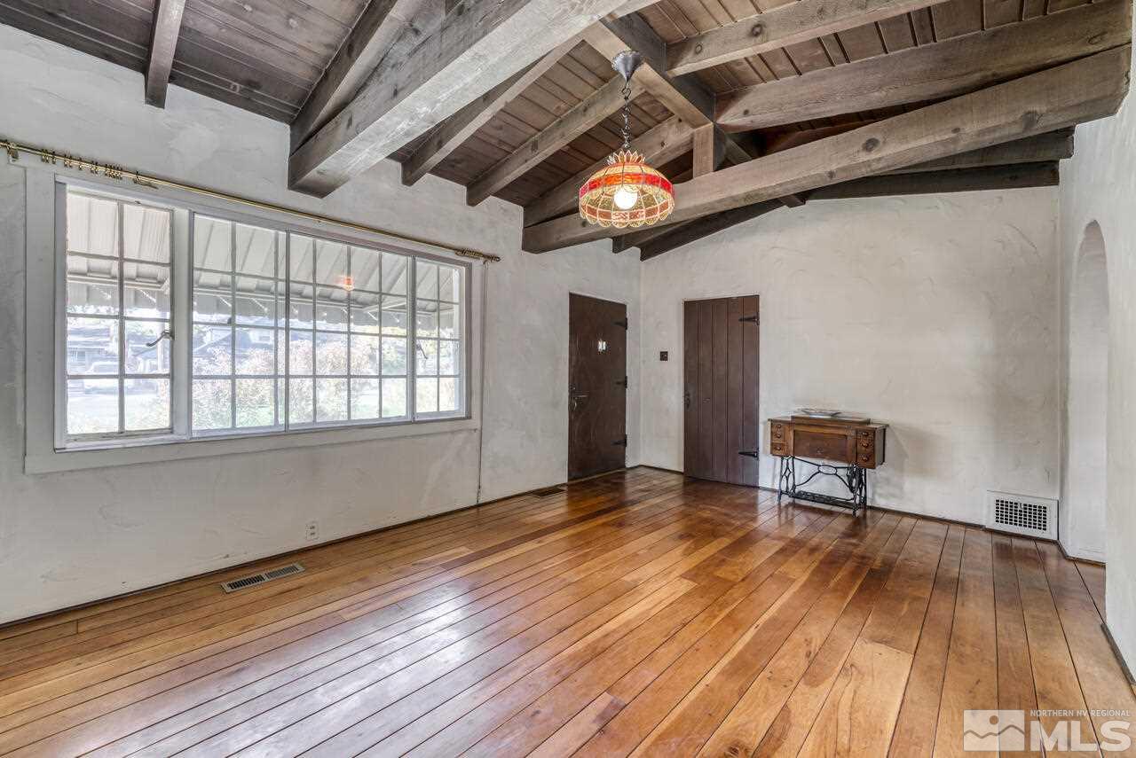 160 Circle Drive Reno, NV 89509 - Photo 7 of 25 a view of an empty room with wooden floor and a window