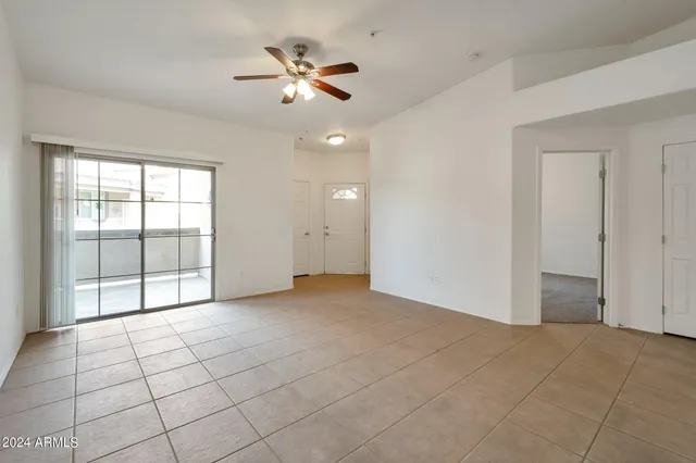 a view of a kitchen with a sink and a ceiling fan