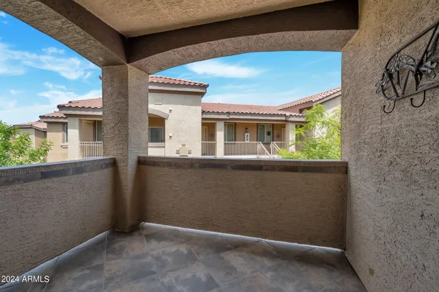 a swimming pool with outdoor seating and yard