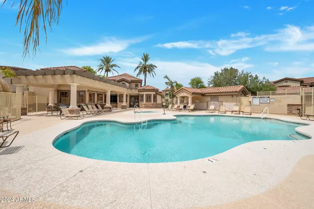 a view of a building with car parked