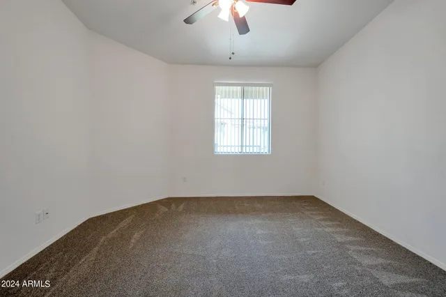 a bathroom with a double vanity sink and a toilet