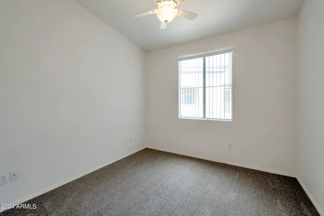 a kitchen with a sink and a refrigerator