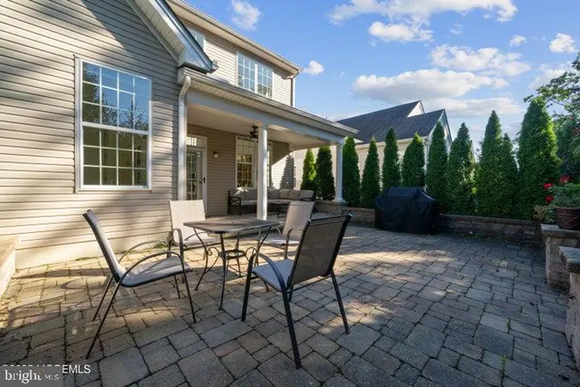 a view of a patio with a table and chairs