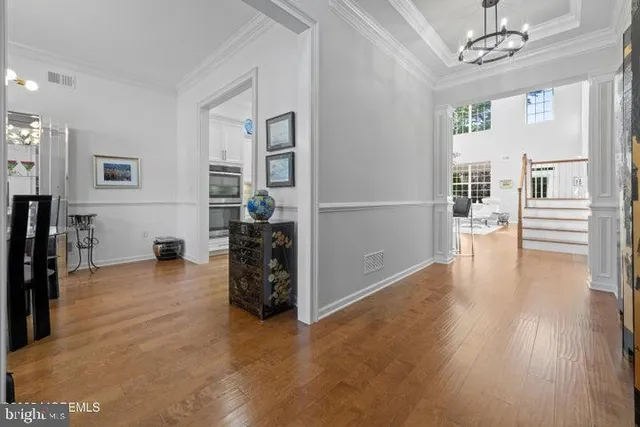 a view of a livingroom with furniture and an empty room