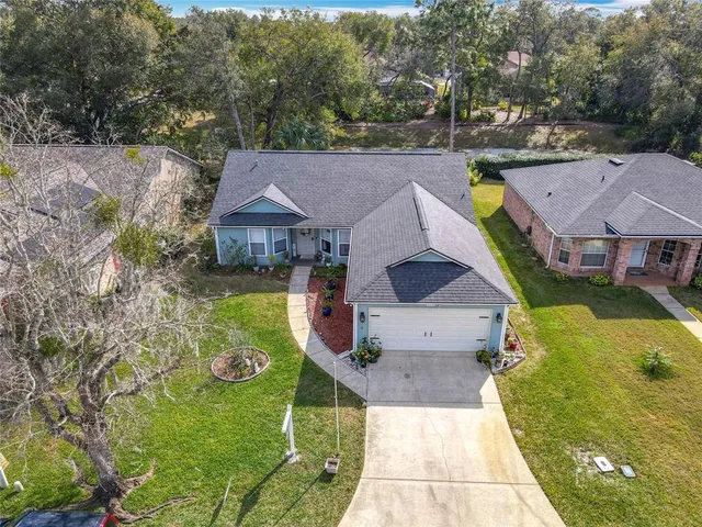 a kitchen with a sink a stove cabinets and a refrigerator