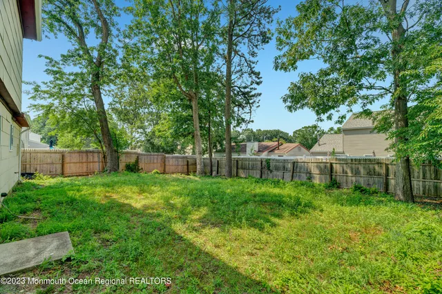 a view of a garden with a house
