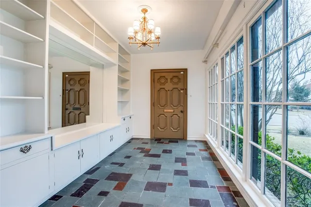 a view of an entryway with wooden floor and a front door