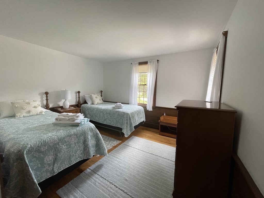12 Seavers Road Orleans, MA 02653 - Photo 12 of 18 a bedroom with two beds and a window