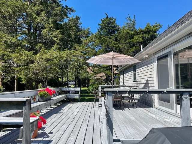 an outdoor space with furniture and umbrella