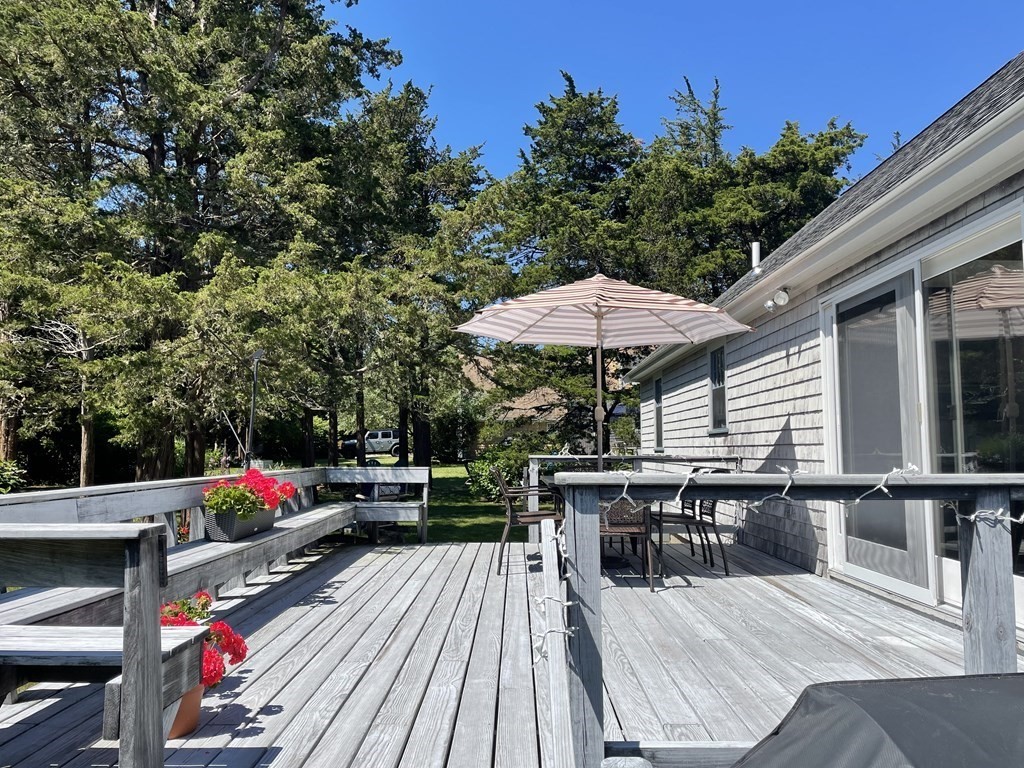 12 Seavers Road Orleans, MA 02653 - Photo 15 of 18 an outdoor space with furniture and umbrella