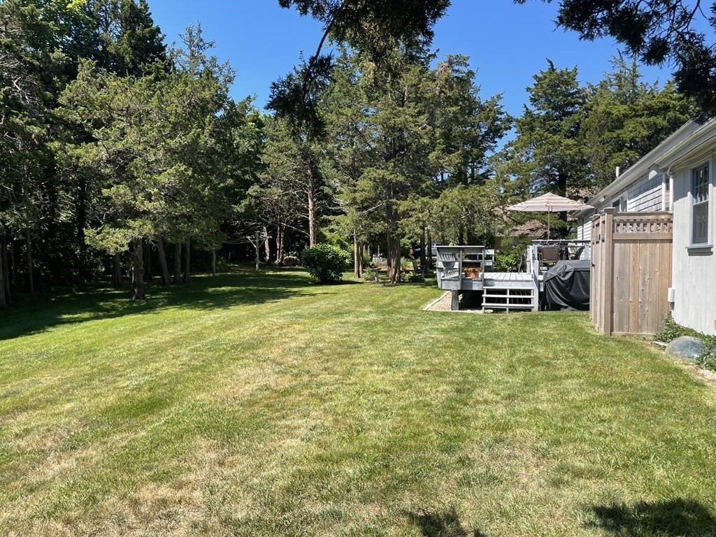 12 Seavers Road Orleans, MA 02653 - Photo 18 of 18 a view of a house with backyard and sitting area